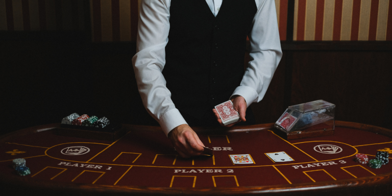Casino dealer with cards